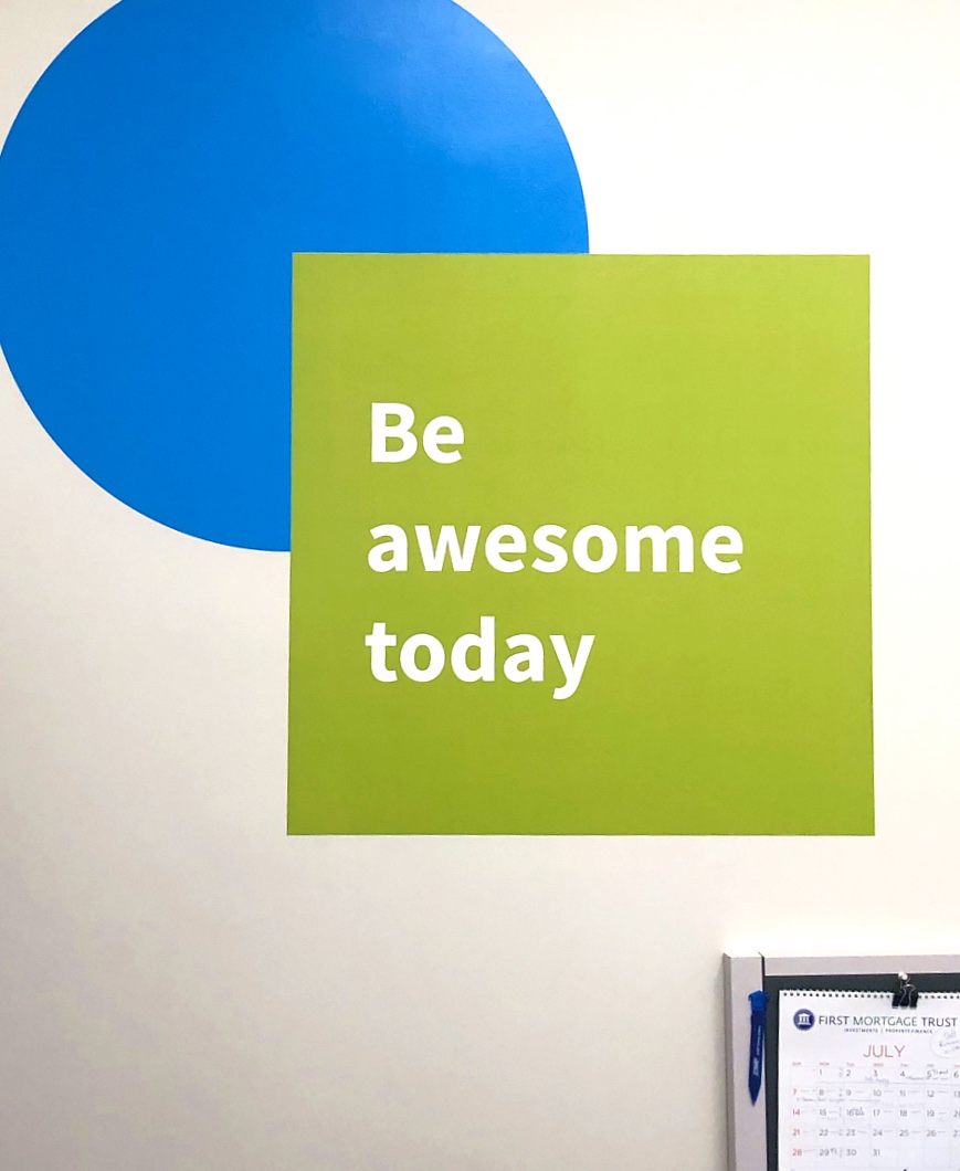 blue and green motivational quote wall decal in modern office