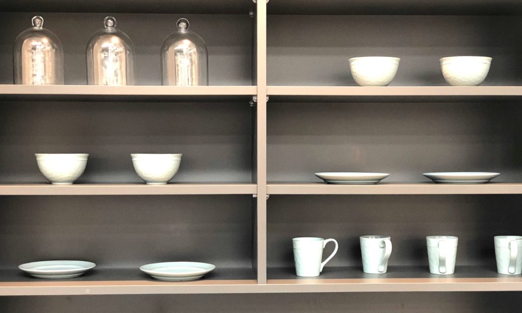 styled kitchen shelves with cups and bowls