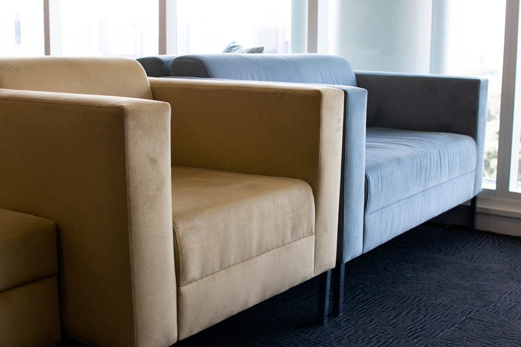 close up of armchairs in mustard and blue grey fabric