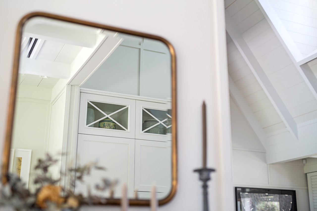 mirror reflection of hamptons style cabinetry detail