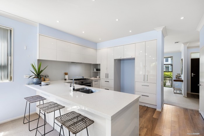 modern white kitchen with white light blue walls