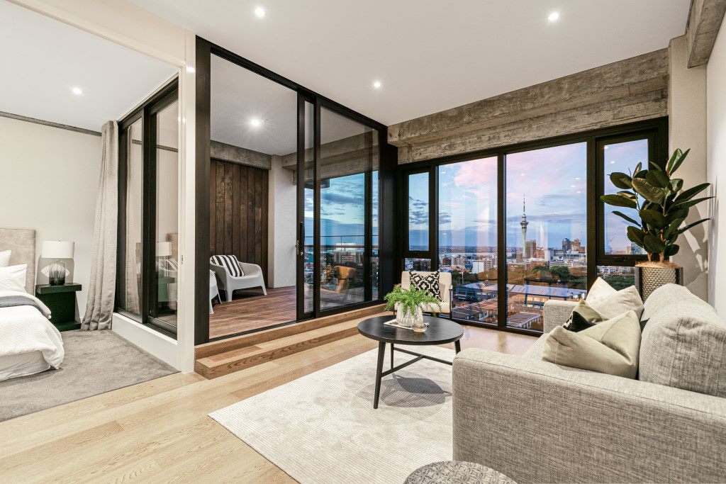 luxury high end Auckland city apartment styling with statement art and industrial textures indoor and outdoor staging