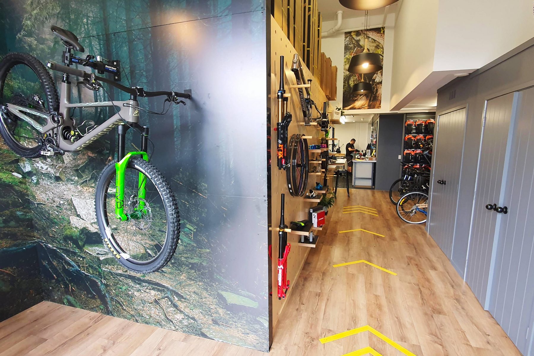bike shop design with wall decals mountain bikes peg board storage and repair workshop